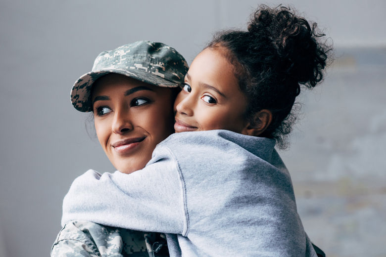 A soldier hugging her daughter